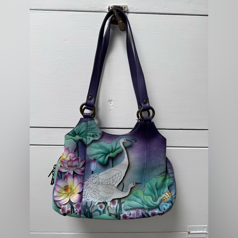 Anuschka hand painted amethyst color leather purse.